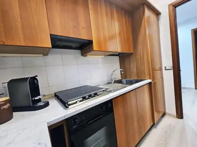 a kitchen with a sink and a stove at Carlo Rusconi 10 - Trastevere in Rome