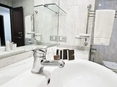 a bathroom with a sink and a faucet at Carlo Rusconi 10 - Trastevere in Rome