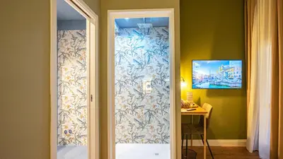 a door leading to a room with a table at Navona Comfort Rooms in Rome