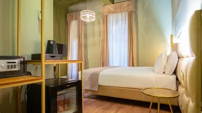 a hotel room with a bed and a television at Navona Comfort Rooms in Rome