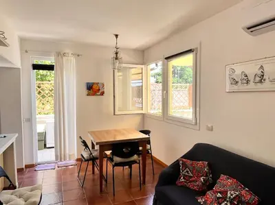 a living room with a table and a couch at Attico luminosissimo, Città Giardino - Monte Sacro in Rome