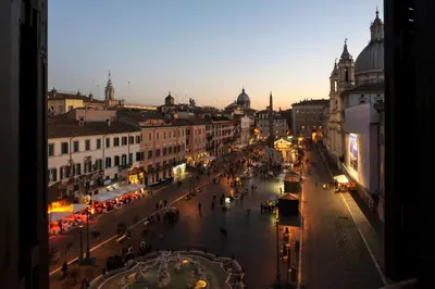 a view of a busy city street at night at Navona 49 Luxury Suites&Apartment in Rome