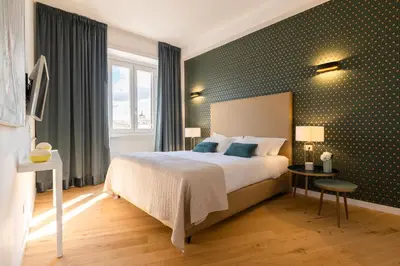 a hotel room with a large bed and a window at Navona 49 Luxury Suites&Apartment in Rome