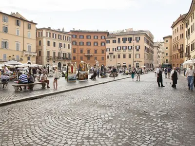 a group of people walking around a city street at Navona 49 Luxury Suites&Apartment in Rome