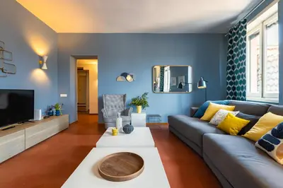 a living room with a couch and a tv at Navona 49 Luxury Suites&Apartment in Rome