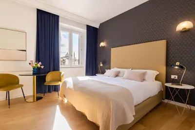 a hotel room with a large bed and a window at Navona 49 Luxury Suites&Apartment in Rome