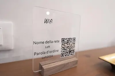 a display case with a sign on a table at Design and Colorful Loft near Villa Pamphili in Rome