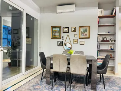 a dining room with a table and chairs at Trastevere Tales in Rome