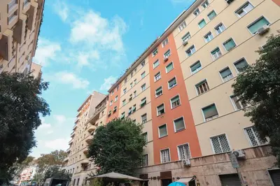 a tall apartment building in a city at Valery - Appartamento Glam vicino al Vaticano in Rome