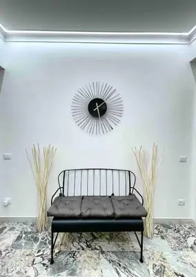 a black bench in a room with a mirror at Roma Lux Apartment Lorenzo in Rome