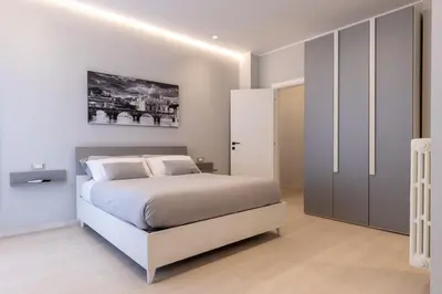 a bedroom with a large bed and a closet at Koala House in Rome