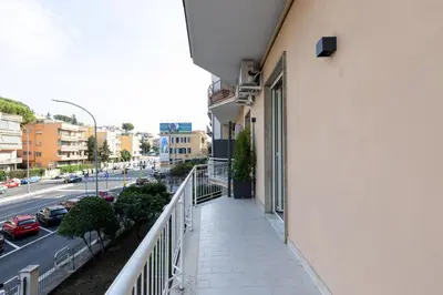 a balcony of a building with a view of a street at Koala House in Rome