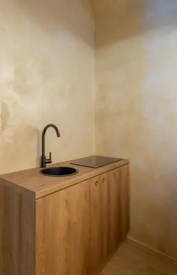 a kitchen counter with a sink in a room at Trastevere Urbes Collection in Rome