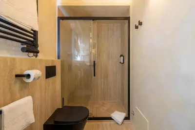 a bathroom with a toilet and a shower at Trastevere Urbes Collection in Rome