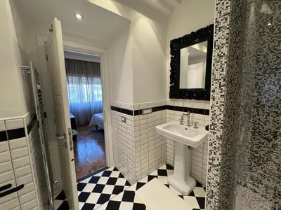 a bathroom with a sink and a mirror at Room 55 Testaccio in Rome
