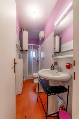 a bathroom with two sinks and a purple ceiling at Casa Vanvitelli - Testaccio in Rome
