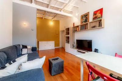 a living room with a couch and a tv at Casa Vanvitelli - Testaccio in Rome