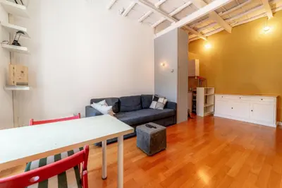 a living room with a couch and a table at Casa Vanvitelli - Testaccio in Rome