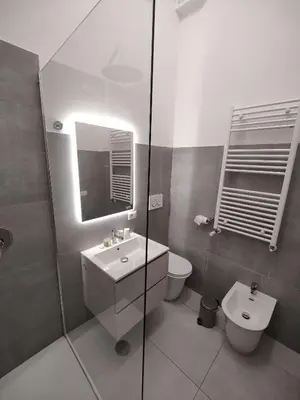 a bathroom with a sink and a toilet and a shower at Lifestyle 168 Guest House in Rome