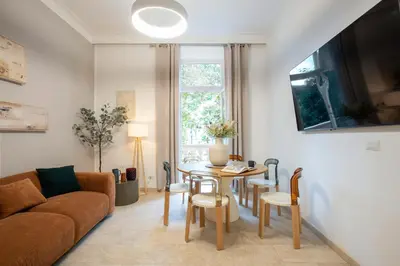 a living room with a table and a couch at BruSilva al Colosseo in Rome