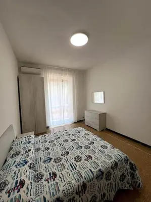 a bedroom with a large bed in a room at Planny Apartment - Vaticano in Rome