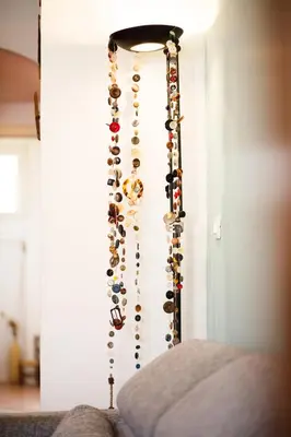 a bunch of wine bottles hanging on a wall at Olimpico Apartment in Rome