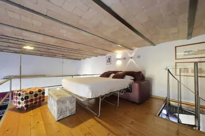 a bedroom with a bed and a couch at Vatican Luxury Apartment in Rome