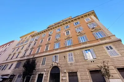 a large building with many windows on the side of it at Vatican Luxury Apartment in Rome