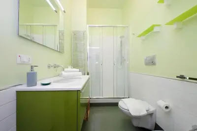 a bathroom with a toilet and a sink and a shower at Vatican Luxury Apartment in Rome