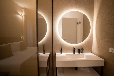 a bathroom with a sink and a mirror at Cicerone's Luxury Suites in Rome