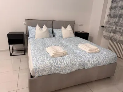 a bedroom with a bed with two towels on it at GIUBILEO PALACE Inn in Rome