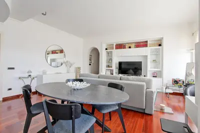a living room with a table and chairs and a couch at Cherry in Rome in Rome