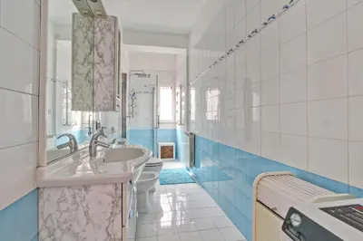 a bathroom with two toilets and a sink at Cherry in Rome in Rome