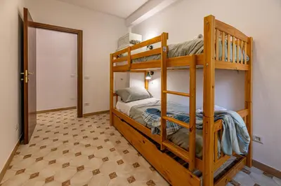a bedroom with two bunk beds in a room at San Peter's Country House in Rome