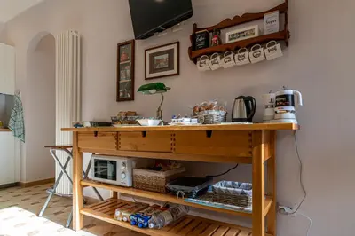 a wooden table with food on top of it at San Peter's Country House in Rome