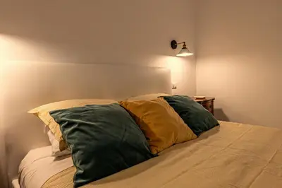 a bed with two pillows on it in a room at San Peter's Country House in Rome