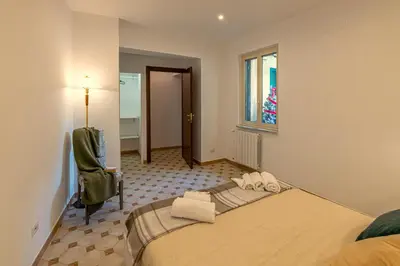 a bedroom with a large bed in a room at San Peter's Country House in Rome