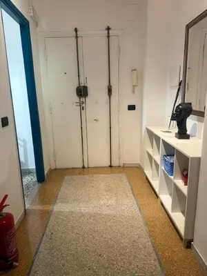 a room with a closet with two doors and a rug at Casa Città del Vaticano in Rome