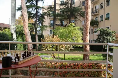 a chess board on a table on a balcony at Casa Fiore in Rome