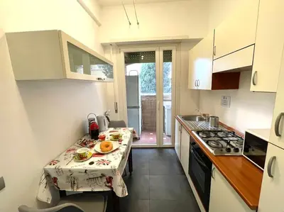 a kitchen with a table with a plate of food on it at Piramide Experience in Rome