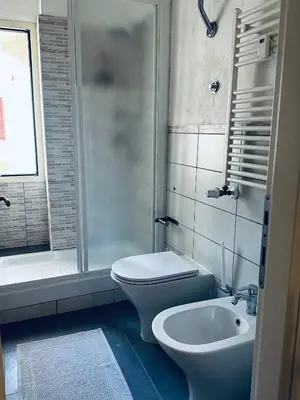 a bathroom with a toilet and a sink at Home Sweet Rome Vatican in Rome