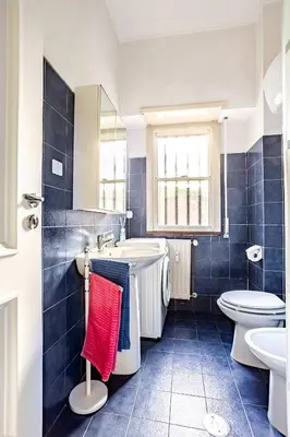 a bathroom with a tub and a toilet and a sink at Daisy Home - Tiburtina loft in Rome WiFi in Rome