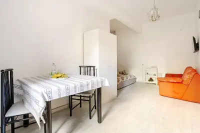 a dining room with a table with bananas on it at Daisy Home - Tiburtina loft in Rome WiFi in Rome