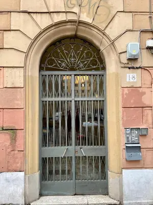 a door with a metal gate in a building at Domus Gaia in Rome