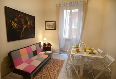 a living room with a couch and a table at Alloggio Machiavelli 59 in Rome
