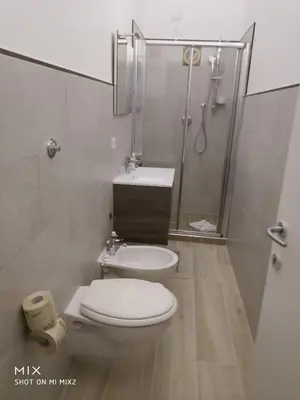 a bathroom with a toilet and a shower and a sink at Alloggio Machiavelli 59 in Rome
