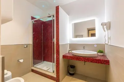 a bathroom with a sink and a shower at Merulana 43 - Guest House in Rome