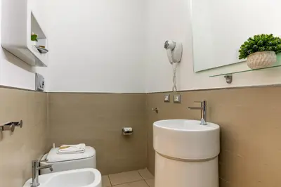 a bathroom with a toilet and a sink at Merulana 43 - Guest House in Rome