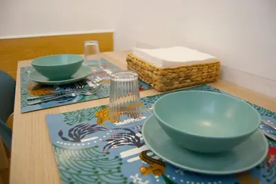a table with two bowls on top of a table at Breathe Romance San Giovanni in Rome