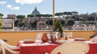a bed with two pillows and a picture on the wall at Rental in Rome Sistina View in Rome